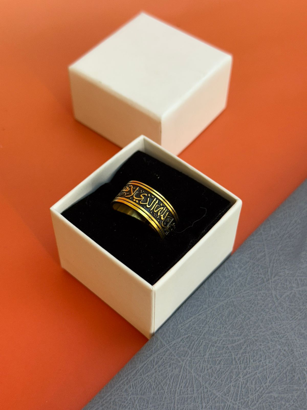 A ring with a religious phrase and laser engraving on the inside