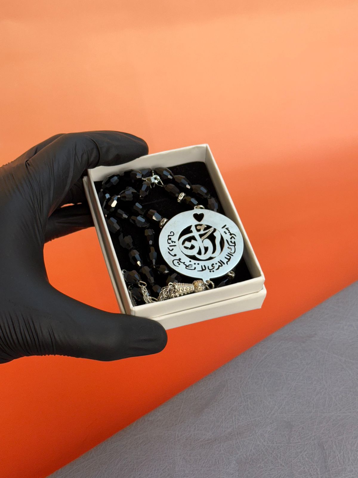 A Rosary with a religious phrase and laser engraving on the inside