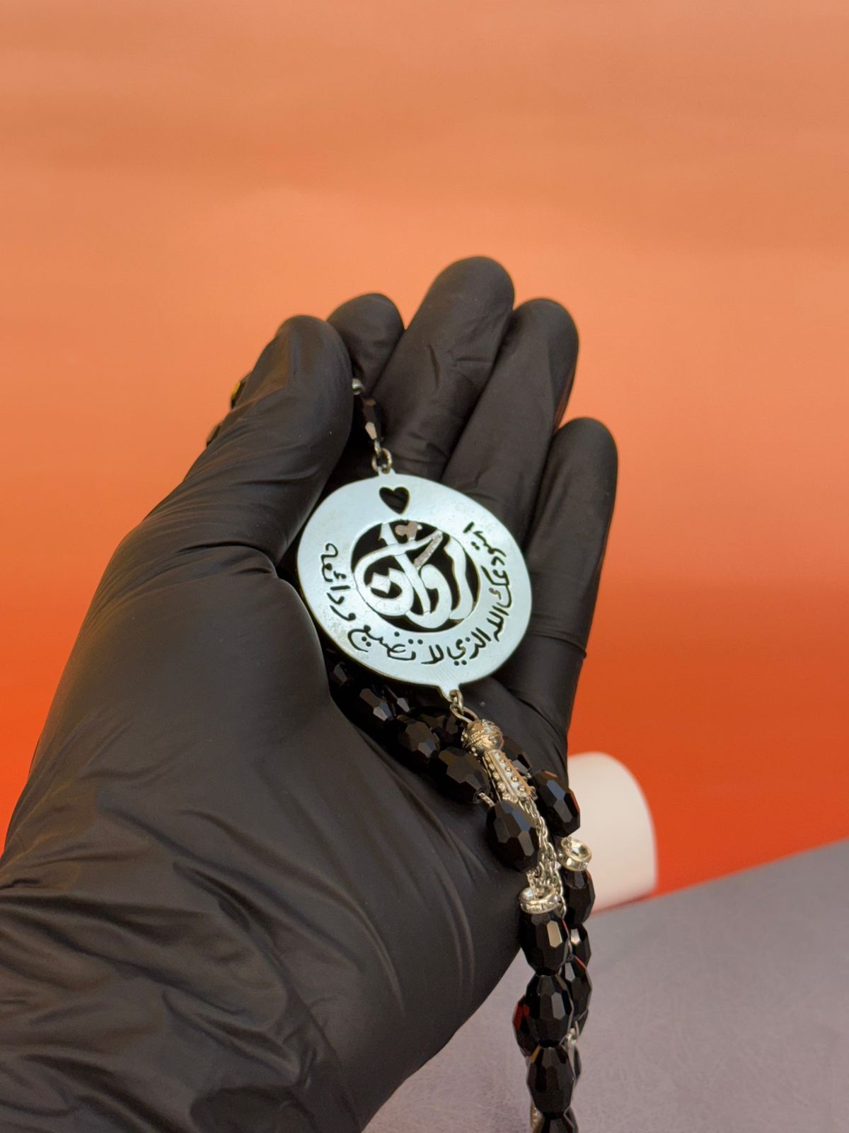 A Rosary with a religious phrase and laser engraving on the inside