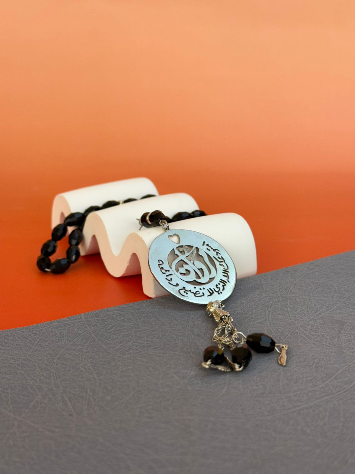A Rosary with a religious phrase and laser engraving on the inside