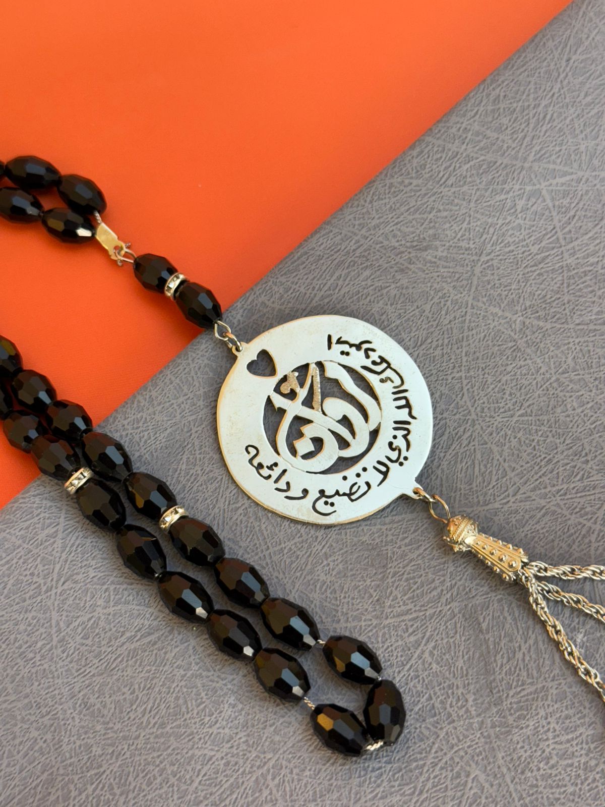 A Rosary with a religious phrase and laser engraving on the inside
